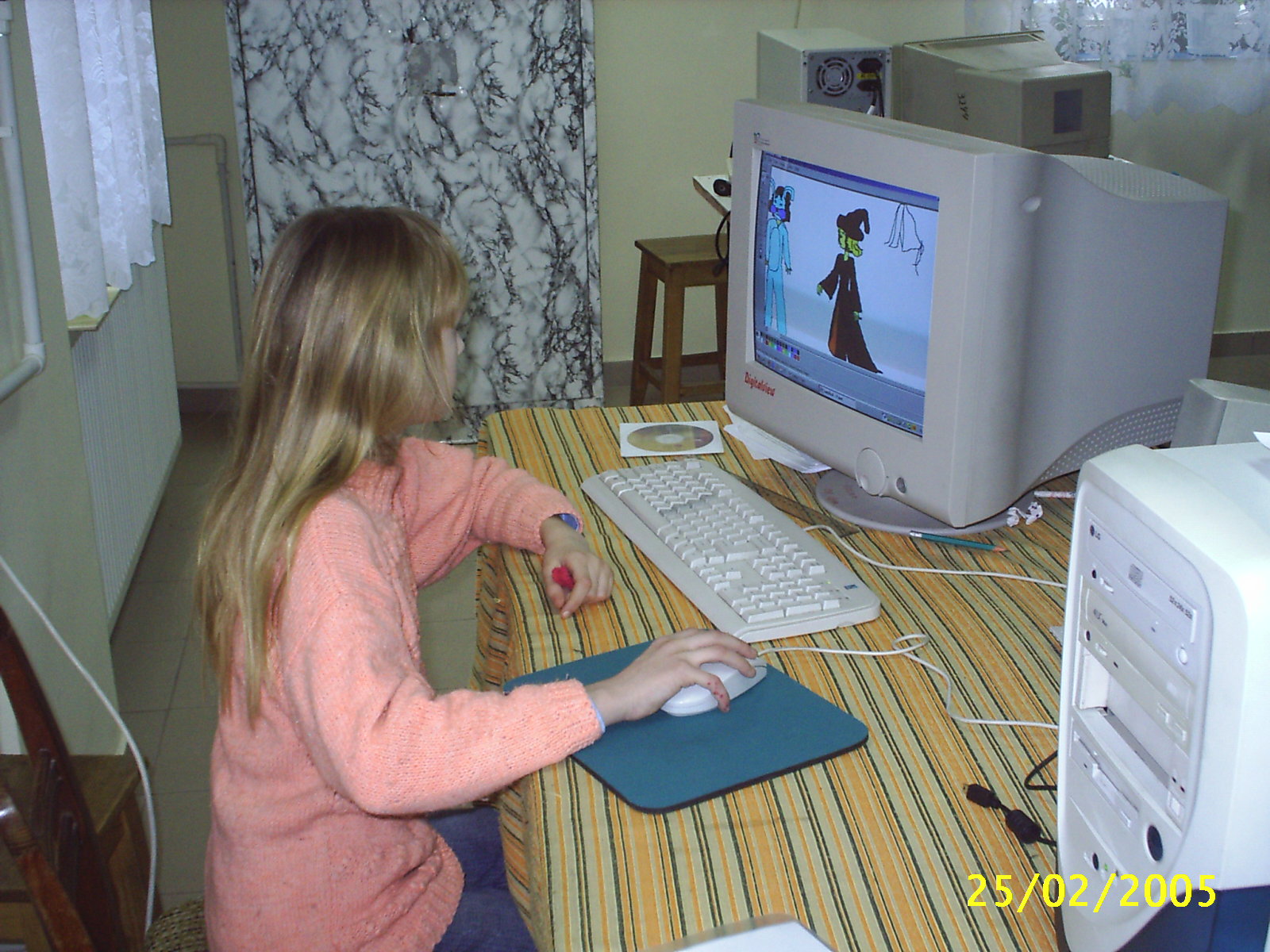 Photograph of Aurora Mititelu drawing in Microsoft Paint in 2005. Courtesy of the artist.