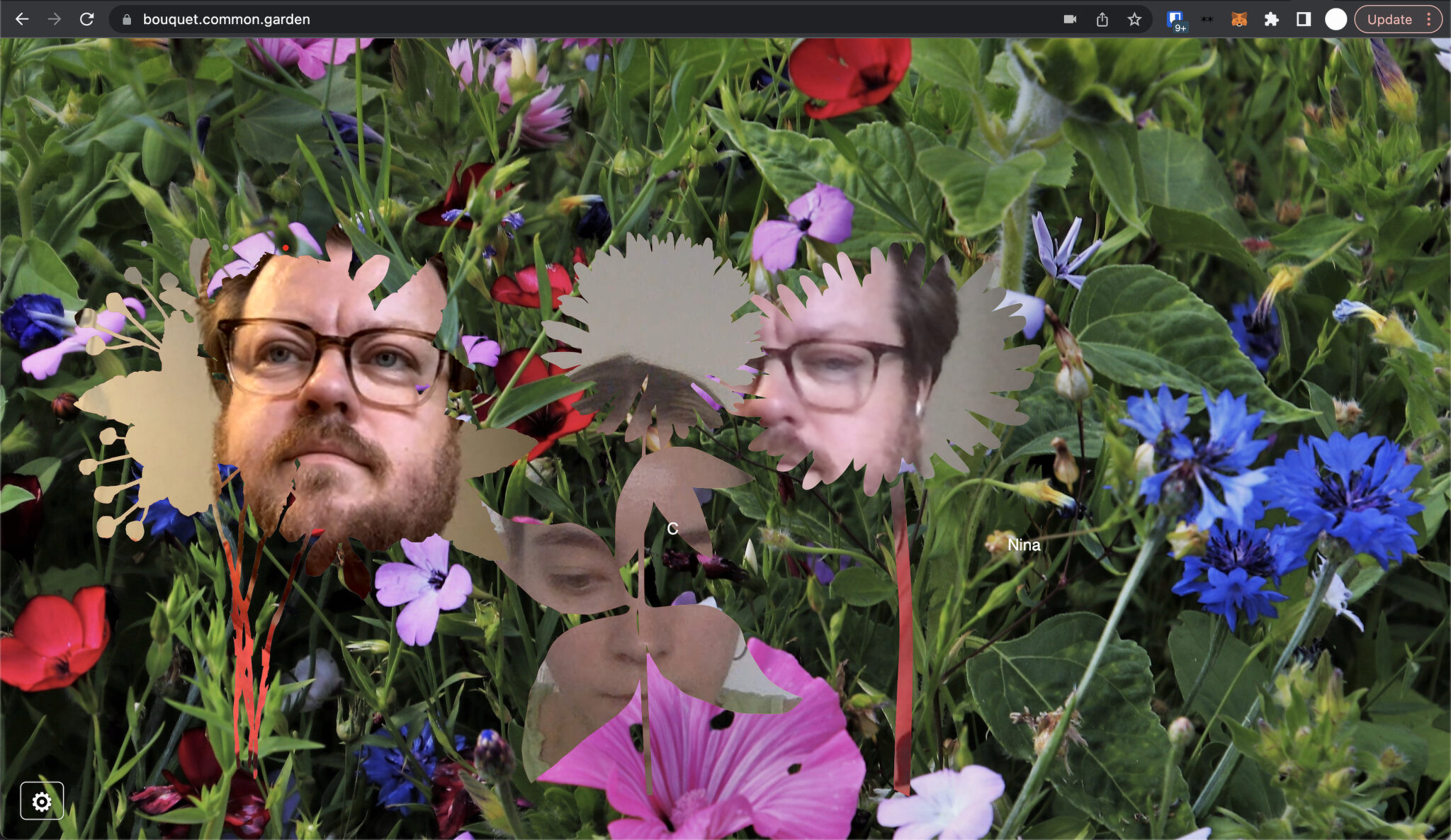 Screenshot taken from an online hangout, bouquet.common.garden, a virtual lush gardenscape full of red, pink, and blue wildflowers in the background.
