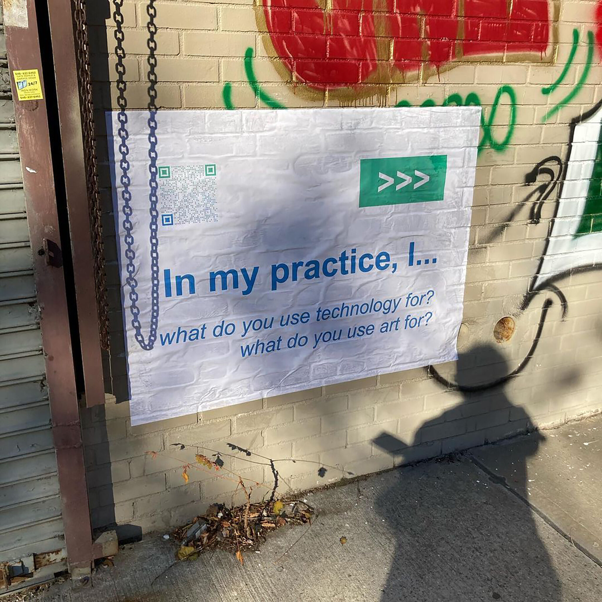 Pictured is a wheatpasted poster with the words, "In my Practice, I"..." prompting the viewer to answer the question of "what do you use technology for? what do you use art for?" on a wall with scribbles of graffitti and tags in many colors.